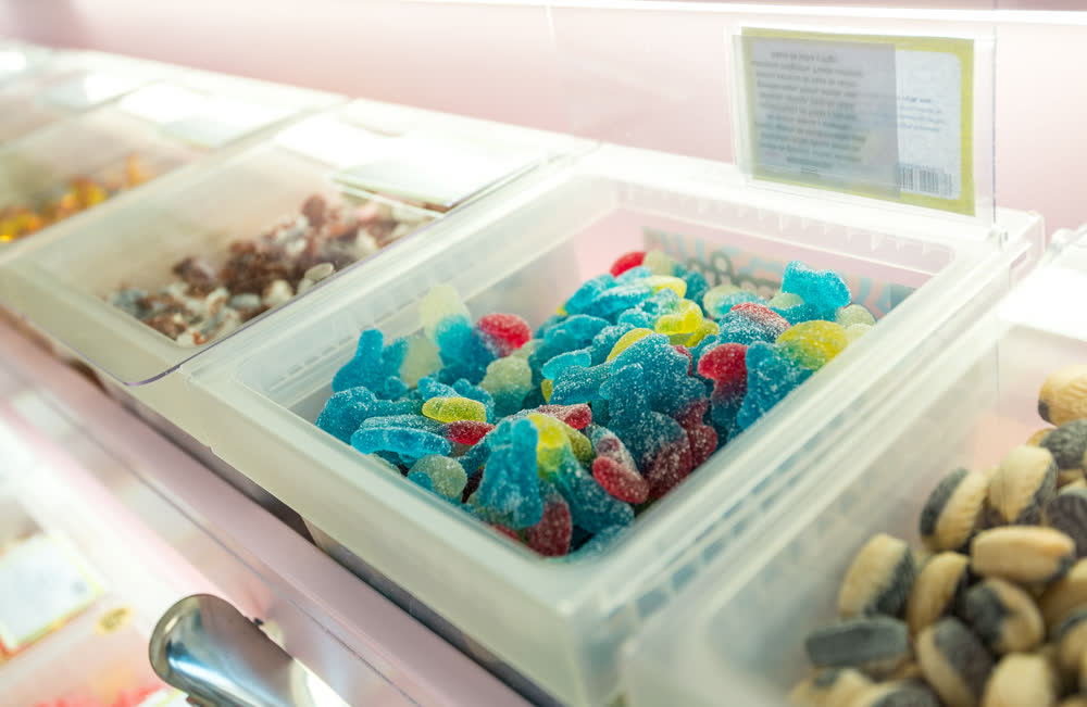 A tub of sour blue and red gummy sweets