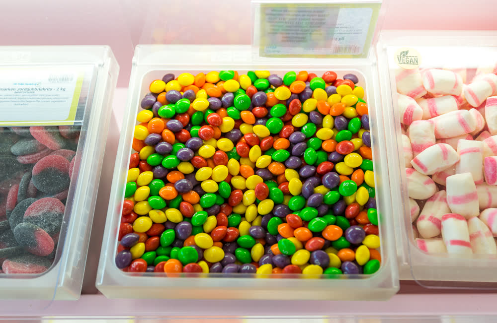 A tub of rainbow fruit-flavored candy